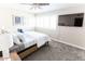Cozy bedroom featuring a bed, mounted TV, and bright, shuttered windows at 4600 N 68Th St # 368, Scottsdale, AZ 85251