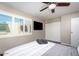Bedroom featuring a comfortable bed with decorative pillows, a TV, and bright windows at 4600 N 68Th St # 368, Scottsdale, AZ 85251
