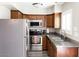 Well-equipped kitchen features stainless steel appliances, granite countertops, and ample cabinet space at 4600 N 68Th St # 368, Scottsdale, AZ 85251