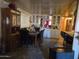 Traditional dining room with a dark wood table and chairs, mirrored cabinets, and elegant decor at 5201 W Camelback Rd # Ofc, Phoenix, AZ 85031