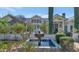 Charming fountain surrounded by lush greenery, enhancing the backyard's tranquil garden at 5431 E Lafayette Blvd, Phoenix, AZ 85018