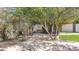 Charming backyard featuring a brick-paved pathway leading to a serene stone fountain surrounded by lush greenery at 5431 E Lafayette Blvd, Phoenix, AZ 85018