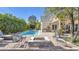 Inviting backyard with a sparkling pool, fire pit, stone barbecue, and a charming outdoor seating area at 5431 E Lafayette Blvd, Phoenix, AZ 85018