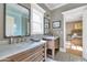 Charming bathroom with dual sinks, marble countertops, and decorative mirrors at 5431 E Lafayette Blvd, Phoenix, AZ 85018