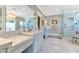 Elegant bathroom with marble countertops, a spacious shower, and a large mirror at 5431 E Lafayette Blvd, Phoenix, AZ 85018