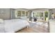 Comfortable bedroom with hardwood floors, white furniture, and ample natural light at 5431 E Lafayette Blvd, Phoenix, AZ 85018