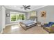 Cozy bedroom with hardwood floors, a comfortable bed, and a large window view at 5431 E Lafayette Blvd, Phoenix, AZ 85018