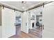 View of bedroom through sliding barn doors with ensuite bathroom and living area with fireplace at 5431 E Lafayette Blvd, Phoenix, AZ 85018