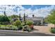 Charming home with a lush front yard, white picket fence, and vibrant rose bushes at 5431 E Lafayette Blvd, Phoenix, AZ 85018