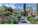 Serene front yard with a beautiful fountain surrounded by rose bushes at 5431 E Lafayette Blvd, Phoenix, AZ 85018