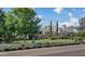 Charming home with a lush front yard, white picket fence, and vibrant rose bushes at 5431 E Lafayette Blvd, Phoenix, AZ 85018