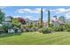 Expansive front yard featuring manicured lawn and colorful rose bushes at 5431 E Lafayette Blvd, Phoenix, AZ 85018