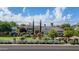 Charming home with a lush front yard, white picket fence, and vibrant rose bushes at 5431 E Lafayette Blvd, Phoenix, AZ 85018