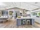 Gorgeous eat-in kitchen featuring a large island, modern lighting, stainless steel appliances and hardwood flooring at 5431 E Lafayette Blvd, Phoenix, AZ 85018