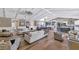 Spacious living room featuring hardwood floors and a large open layout connecting to kitchen at 5431 E Lafayette Blvd, Phoenix, AZ 85018