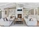 Cozy living room features a fireplace, built-in bookshelves, and comfortable seating at 5431 E Lafayette Blvd, Phoenix, AZ 85018