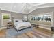 Bright main bedroom with vaulted ceilings, chandelier, hardwood floors and large picture windows at 5431 E Lafayette Blvd, Phoenix, AZ 85018