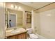 Bathroom with a vanity with granite countertop, big mirror, and shower-tub combo at 604 W Villa Rita Dr, Phoenix, AZ 85023