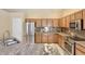 Modern kitchen featuring stainless steel appliances, elegant granite countertops, and ample cabinet space at 604 W Villa Rita Dr, Phoenix, AZ 85023
