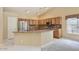 Spacious open concept eat-in kitchen features granite countertops and stainless appliances at 604 W Villa Rita Dr, Phoenix, AZ 85023