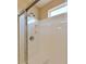 Shower stall featuring a rainfall shower head and built-in seat at 604 W Villa Rita Dr, Phoenix, AZ 85023