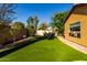 Landscaped backyard with lush greenery, offering a serene and private outdoor space at 6820 W Angela Dr, Glendale, AZ 85308