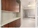 Bathroom with cabinets and an open shower area at 6820 W Angela Dr, Glendale, AZ 85308