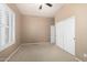 Bedroom with plantation shutters and closet at 6820 W Angela Dr, Glendale, AZ 85308