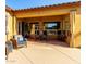 Inviting covered patio with comfortable seating, creating an ideal outdoor living space at 6820 W Angela Dr, Glendale, AZ 85308