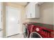 Laundry room with front loading washer and dryer at 6820 W Angela Dr, Glendale, AZ 85308