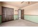 Bedroom with a ceiling fan, closet, two-tone walls and adjacent bathroom view at 7656 W Wagoner Rd, Glendale, AZ 85308
