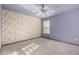 Cozy bedroom with carpet floors and a ceiling fan at 7656 W Wagoner Rd, Glendale, AZ 85308