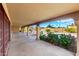 Spacious covered patio with stylish columns and stone flooring, ideal for outdoor entertaining and relaxation at 7656 W Wagoner Rd, Glendale, AZ 85308
