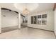 Dining room featuring tile flooring, wood beams, and a hanging light fixture at 7656 W Wagoner Rd, Glendale, AZ 85308