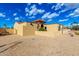 Beige home displaying terra cotta tile roofing and drought-resistant landscaping at 7656 W Wagoner Rd, Glendale, AZ 85308