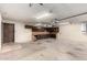 Garage space with overhead door, shelving and cabinets for storage at 7656 W Wagoner Rd, Glendale, AZ 85308