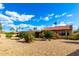 Lovely single-story home featuring desert landscaping and a charming facade, enhancing its curb appeal at 7656 W Wagoner Rd, Glendale, AZ 85308