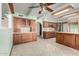 Traditional kitchen with wooden cabinets, tile flooring, and ample counter space at 7656 W Wagoner Rd, Glendale, AZ 85308