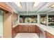 Kitchen featuring plenty of counter space with a large sink and a view to the outside at 7656 W Wagoner Rd, Glendale, AZ 85308