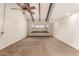 Spacious living room with beamed ceilings, carpeted floors, and a cozy window nook at 7656 W Wagoner Rd, Glendale, AZ 85308