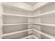 Walk-in pantry featuring ample storage with adjustable shelving at 7656 W Wagoner Rd, Glendale, AZ 85308