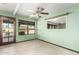 Bright sitting room with tile flooring and access to the outside at 7656 W Wagoner Rd, Glendale, AZ 85308