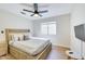 Bedroom with modern wooden bed frame, plush bedding, bedside tables, and an abundance of natural light at 832 N Blue Marlin Dr, Gilbert, AZ 85234