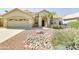 Inviting single-story home with desert landscaping, complemented by a two-car garage and tiled roof at 832 N Blue Marlin Dr, Gilbert, AZ 85234