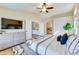 Bright main bedroom with ensuite bath, featuring neutral tones, large windows, and plush carpeting at 832 N Blue Marlin Dr, Gilbert, AZ 85234