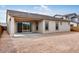 Backyard featuring a covered patio and a large, unfinished yard at 8324 W Palo Verde Dr, Glendale, AZ 85305