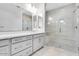 Bathroom featuring dual vanities, a tiled shower with a bench, and neutral countertops at 8324 W Palo Verde Dr, Glendale, AZ 85305