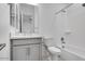 Well-lit bathroom featuring a shower-tub combo and modern vanity at 8324 W Palo Verde Dr, Glendale, AZ 85305