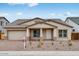 Charming single-story home featuring a well-manicured front yard and attached two-car garage at 8324 W Palo Verde Dr, Glendale, AZ 85305