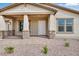 Inviting front porch with stone accents and brick pathway leading to the front door at 8324 W Palo Verde Dr, Glendale, AZ 85305